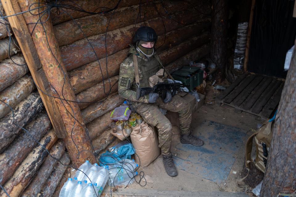 A member of Ukraine’s 95th Air Assault Brigade sitting inside a makeshift barrage near the frontline of fighting outside Kreminna (Getty Images)