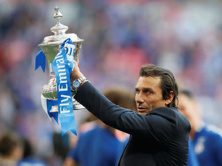 Soccer Football - FA Cup Final - Chelsea vs Manchester United - Wembley Stadium, London, Britain - May 19, 2018 Chelsea manager Antonio Conte celebrates winning the final with the trophy REUTERS/David Klein