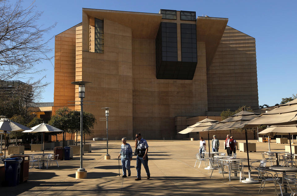 FILE - In this Monday, Jan. 21, 2013 file photo, visitors tour the grounds of the Cathedral of Our Lady of the Angels the seat of the Archdiocese of Los Angeles. The archdiocese told The Associated Press in a 2020 survey sent before the release of federal data, that 247 of its 288 parishes - and all but one of its 232 schools - received loans from the U.S. Small Business Administration. (AP Photo/Damian Dovarganes)