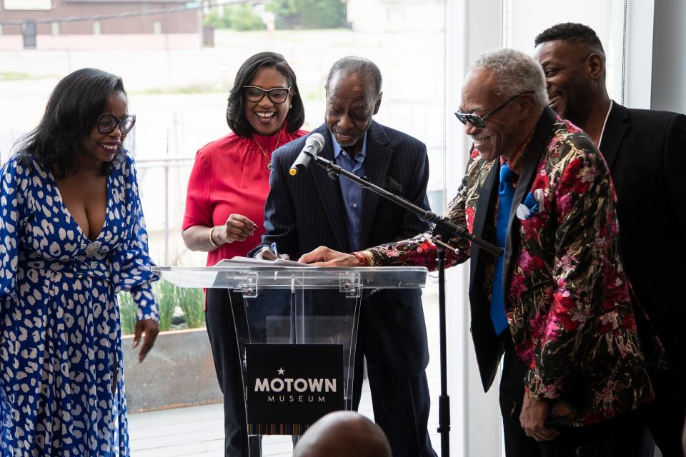 The Spinners' cofounder Henry Fambrough, center, signs the deed of gift for a donation to the Motown Museum next to fellow members G.C. Cameron, right, Jessie Peck, far right, Motown Museum Chairwoman and CEO Robin Terry, center left, and Spinners brand strategist Tanisha Jackson, far left, at the Motown Museum in Detroit on Friday, May 19, 2023.