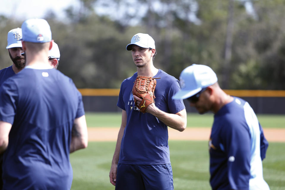 Tampa Bay Rays Charlie Morton talks with teammates during spring baseball practice Thursday, Feb. 13, 2020 in Port Charlotte, Fla. (Octavio Jones/Tampa Bay Times via AP)