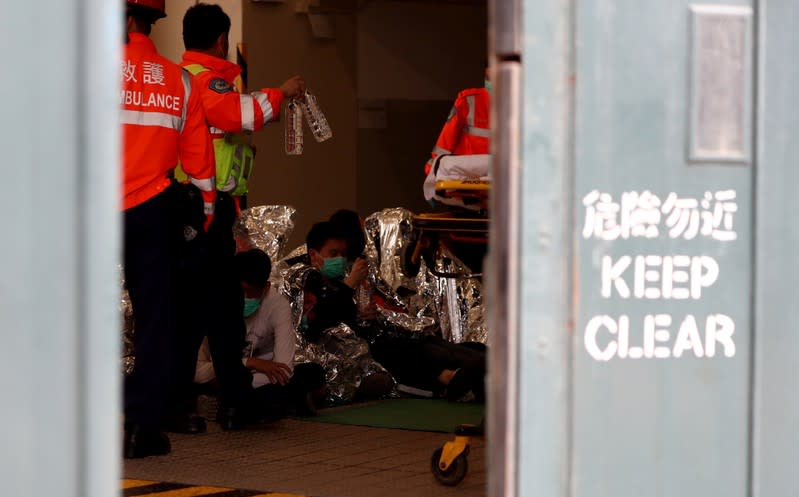 Protesters receive medical attention after leaving the campus of the Hong Kong Polytechnic University
