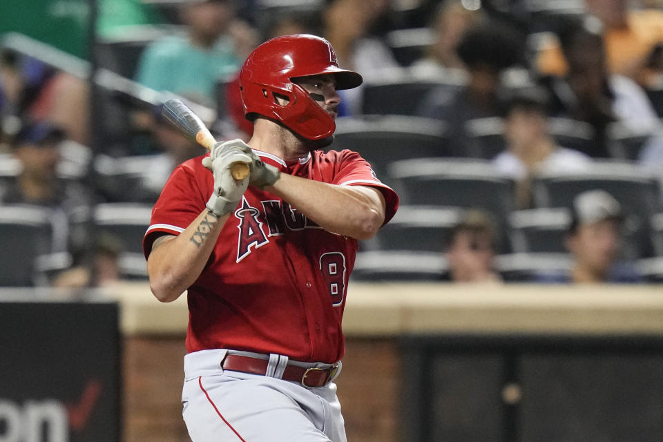 Los Angeles Angels' Mike Moustakas (8) hits an RBI single during the third inning of a baseball game against the New York Mets, Friday, Aug. 25, 2023, in New York. (AP Photo/Frank Franklin II)