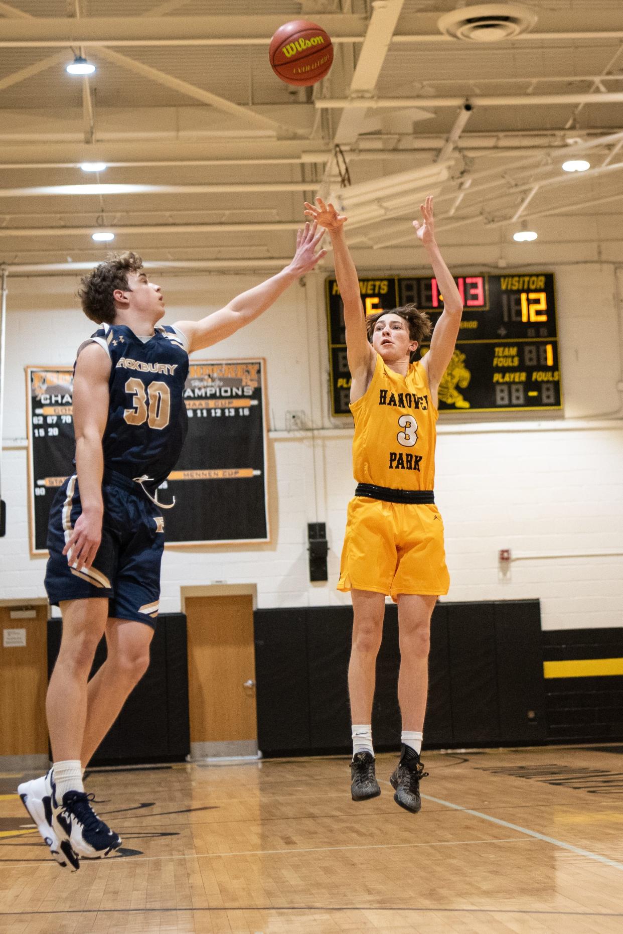 The Hanover Park boys basketball team plays Roxbury in the Morris County Tournament opening round on Friday Jan. 28, 2022.( From left) R #30 Connor Patton and HP #3 Johnny Karpinski. 