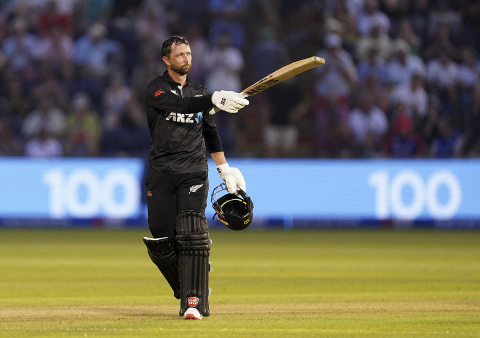 New Zealand's Devon Conway celebrates reaching his century during the first one day international match between England and New Zealand in Cardiff, Wales, Friday Sept. 8, 2023. (Joe Giddens/PA via AP)