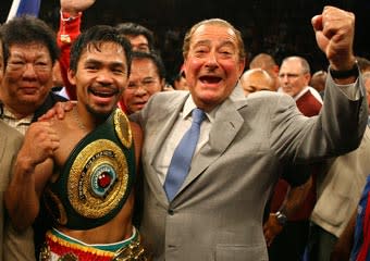 Manny Pacquiao celebrates with promoter Bob Arum after knocking down Ricky Hatton of England in the second round during their junior welterweight title fight in Las Vegas on May 2, 2009