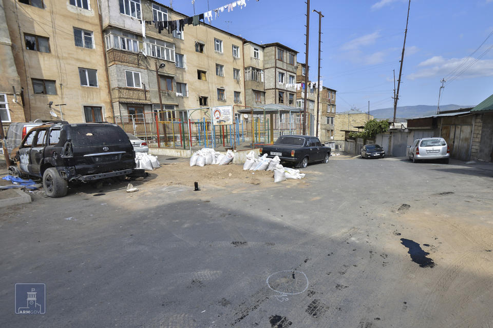 In this photo issued by Armenian Foreign Ministry shows the scene after shelling in Stepanakert, the self-proclaimed Republic of Nagorno-Karabakh, Azerbaijan, Tuesday, Sept. 29, 2020. Armenian and Azerbaijani forces accused each other of attacks on their territory Tuesday, as fighting over the separatist region of Nagorno-Karabakh continued for a third straight day following the reigniting of a decades-old conflict. (Armenian Foreign Ministry via AP)