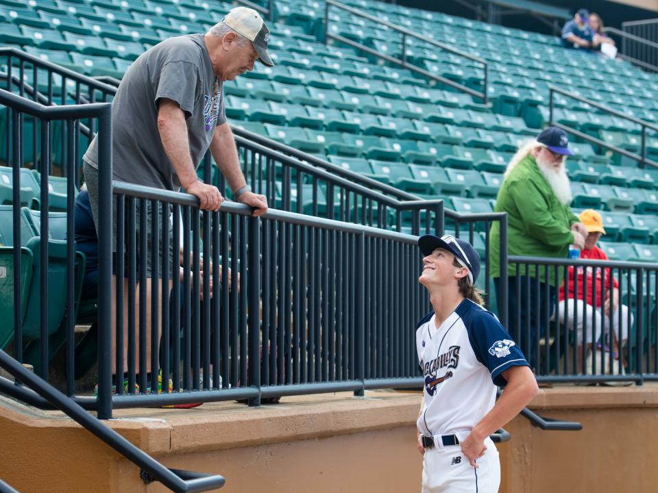 Catcher Dylan LaRue talks to a fan during the Jackson Rockabillys' "Greet the Goats" event inside The Ballpark in Jackson on Tuesday, May 30, 2023. 