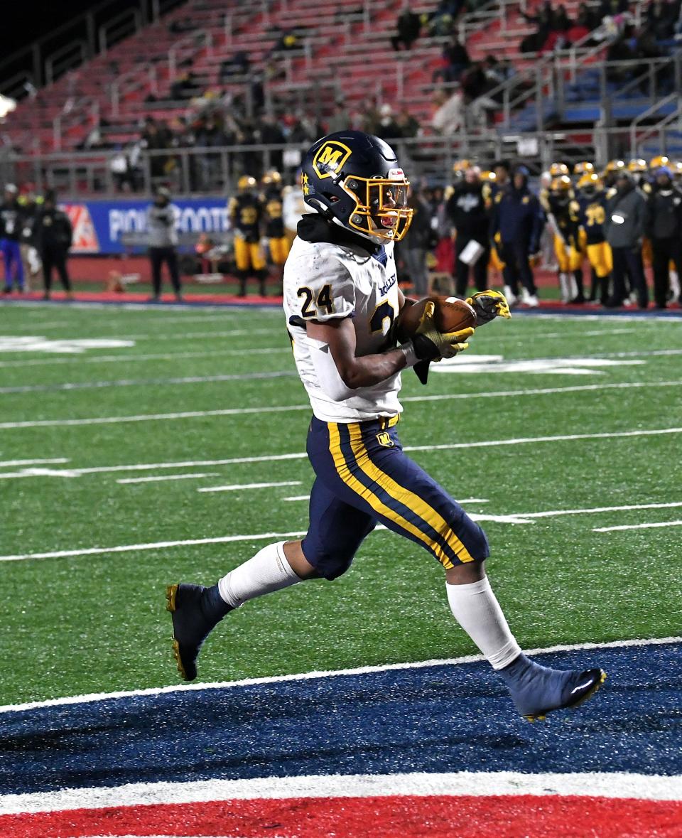 Jordan Marshall cruises into the endzone for a Moeller touchdown in the OHSAA Division I football state semifinals at Piqua, Ohio, Nov. 24, 2023.