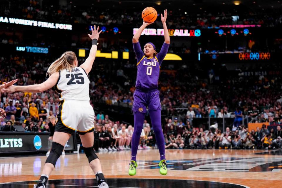 Apr 2, 2023; Dallas, TX, USA; LSU Lady Tigers forward LaDazhia Williams (0) attempts a three-point basket against Iowa Hawkeyes forward Monika Czinano (25) in the second half during the final round of the Women’s Final Four NCAA tournament at the American Airlines Center. Mandatory Credit: Kirby Lee-USA TODAY Sports