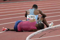 Isaiah Jewett, of the United States, and Nijel Amos, background, of Botswana, fall in the men's 800-meter semifinal at the 2020 Summer Olympics, Sunday, Aug. 1, 2021, in Tokyo. (AP Photo/Jae C. Hong)