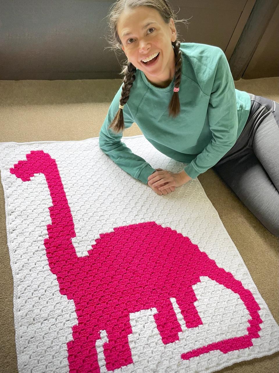 Sutton Foster posing with different baby blankets