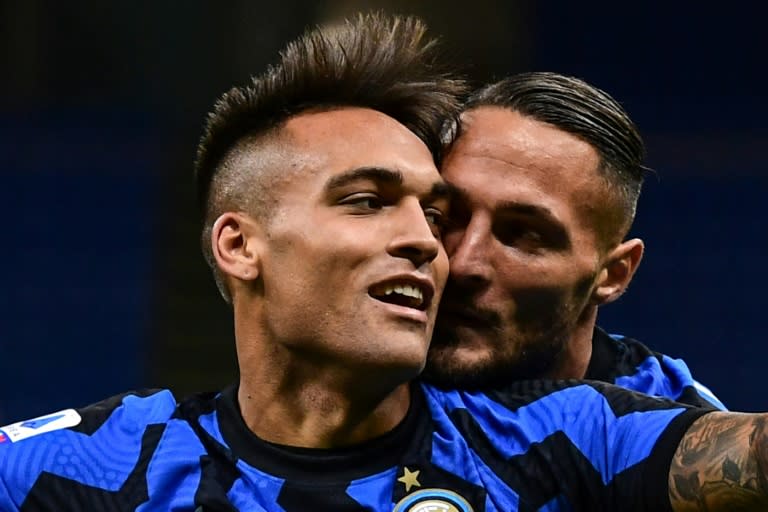 Inter Milan's Argentine forward Lautaro Martinez (L) has scored in each of the first three matches this season.