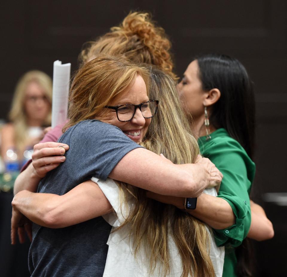 Representative Sharice Davids (D-KS) shares a group hug with women during the pro-choice Kansas for Constitutional Freedom primary election watch party in Overland Park, Kansas August 2, 2022.