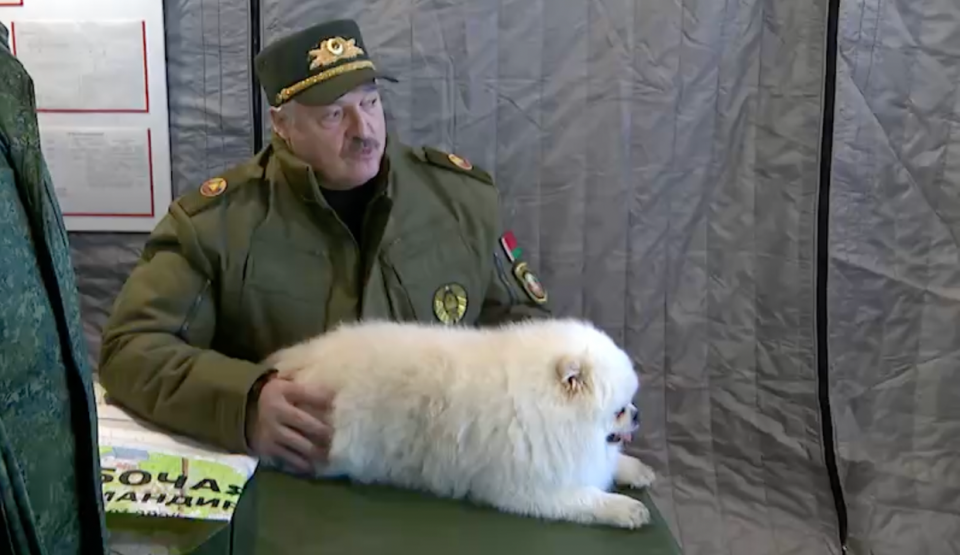 Belarusian dictator Alexander Lukashenko speaks with the country’s military command while dressed in full military gear and petting his dog on March 26, 2024. (Courtesy)