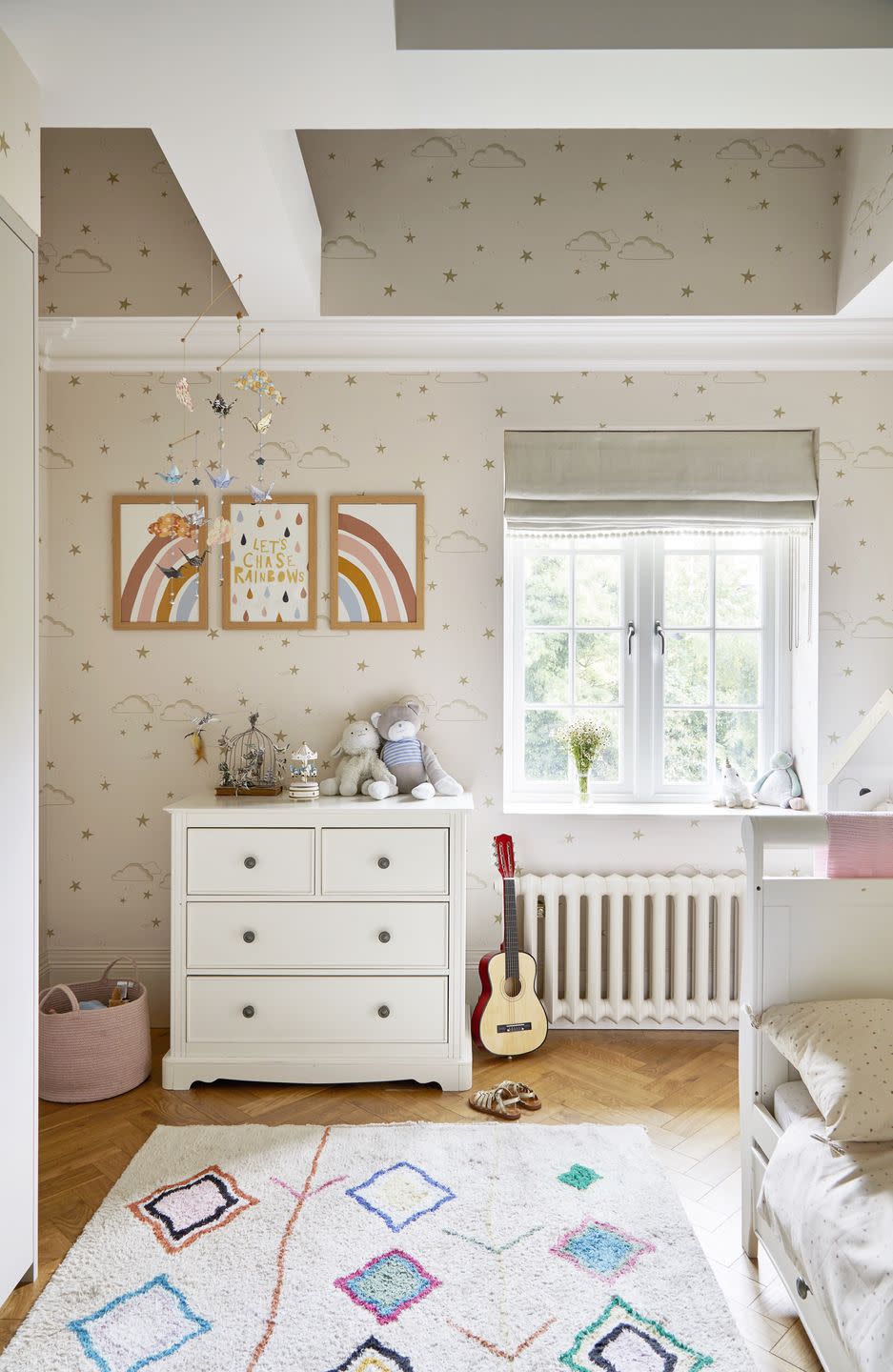 children's bedroom with starry wallpaper and rug