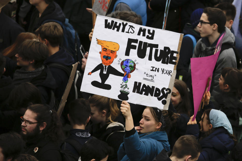 Students attend a protest rally of the 'Friday For Future Movement in Berlin, Germany, Friday, March 29, 2019. Thousands of students are gathering in the German capital, skipping school to take part in a rally demanding action against climate change. (AP Photo/Markus Schreiber)