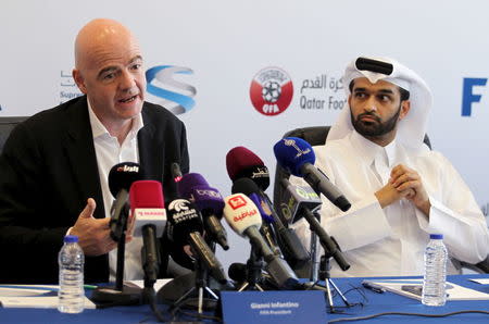 FIFA's newly elected president Gianni Infantino (L) and Secretary General of the Qatar 2022 Supreme Committee, Hassan Abdulla Al Thawadi attend a news conference in Doha, Qatar, April 22, 2016. REUTERS/Naseem Zeitoon