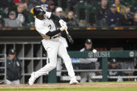 Chicago White Sox's Tim Anderson hits an RBI single off Boston Red Sox starting pitcher Nick Pivetta during the fifth inning of a baseball game Tuesday, May 24, 2022, in Chicago. (AP Photo/Charles Rex Arbogast)