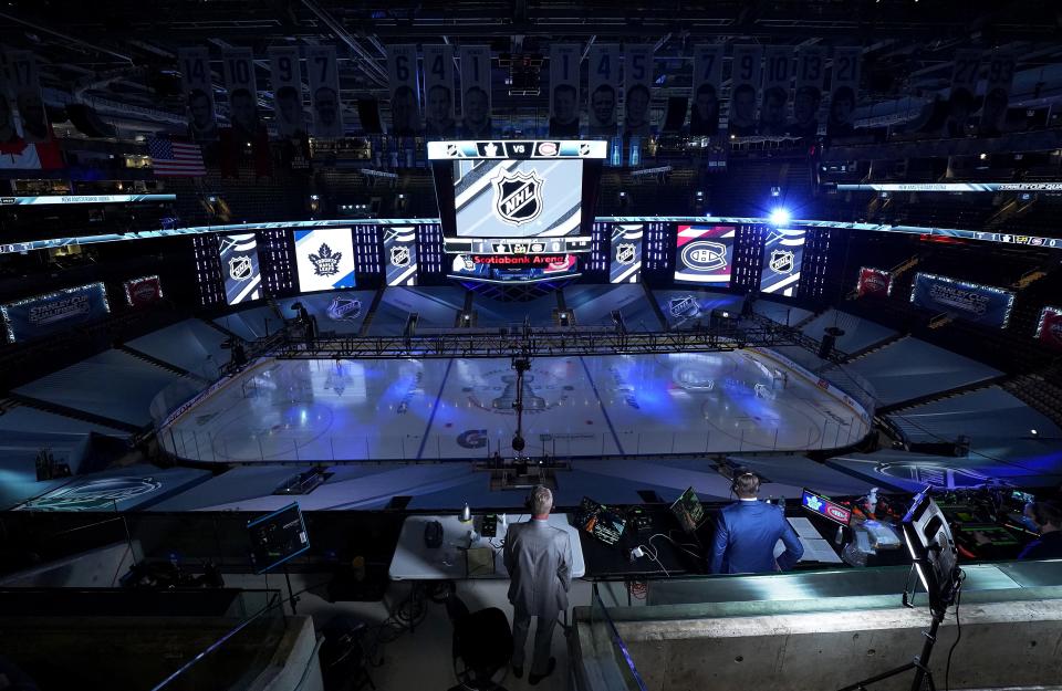 Broadcast media prepares for the start of the second period as the Toronto Maple Leafs and the Montreal Canadiens take the ice during an exhibition game prior to the 2020 NHL Stanley Cup Playoffs at Scotiabank Arena on July 28, 2020, in Toronto.