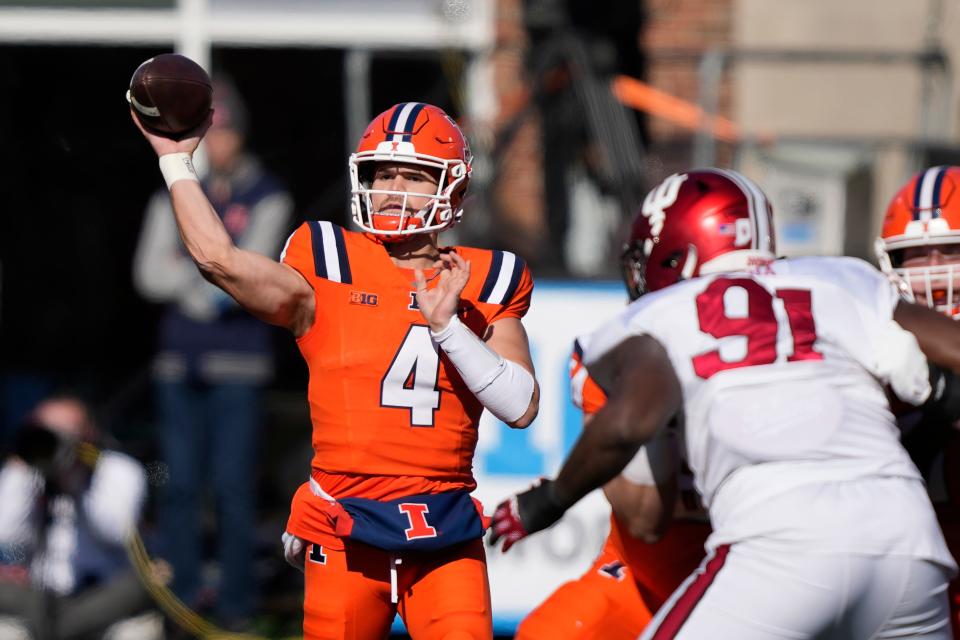 Illinois quarterback John Paddock passes during the first half of an NCAA college football game against Indiana on Saturday, Nov. 11, 2023, in Champaign, Ill. (AP Photo/Charles Rex Arbogast)