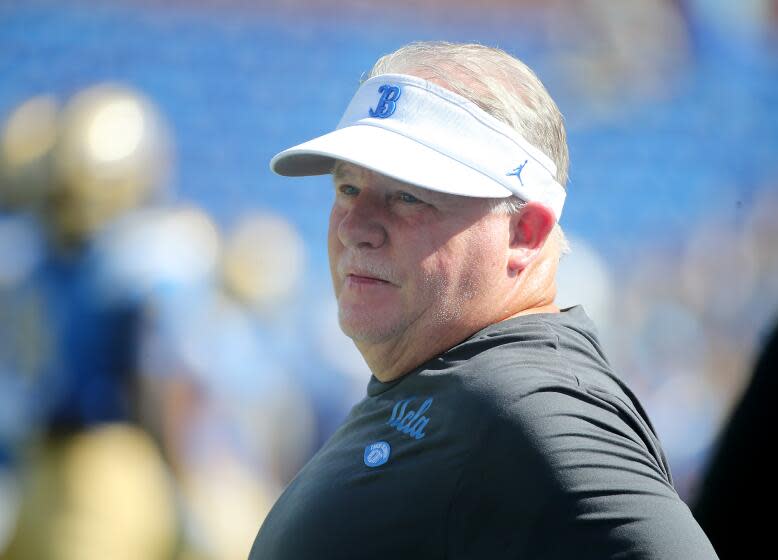 Pasadena, CA - UCLA Bruins head coach Chip Kelly watches his team warm up before a Pac-12 Conference game against the Washington State Cougars at the Rose Bowl in Pasadena on Saturday, Oct. 7, 2023. Bruins won, 25 -17. (Luis Sinco / Los Angeles Times)
