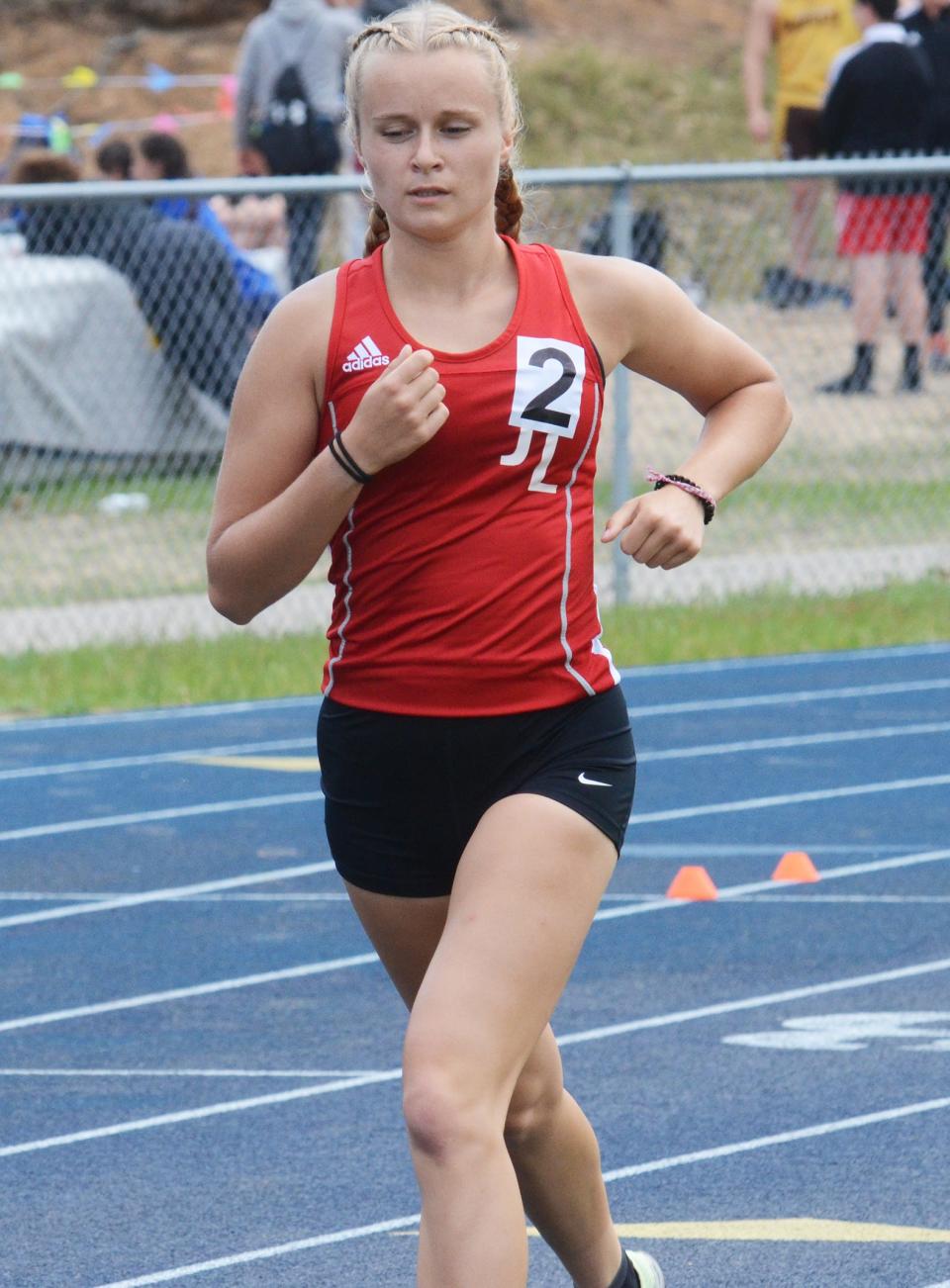 Allie Nowak participates in the 1600-meter run during the MHSAA Region 31-4 track meet on Friday, May 19 in Indian River, Mich.