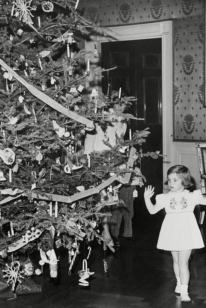 Caroline Kennedy looks at the White House holiday decorations in 1961. - Credit: Rex Shutterstock