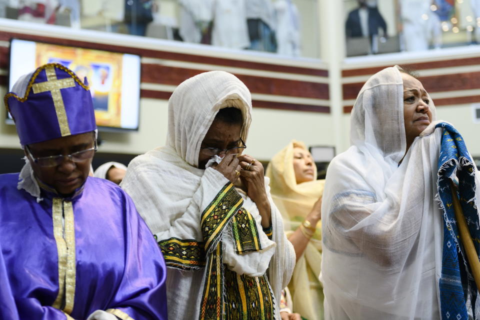 Members of the Ethiopian community take part in a special prayer for the victims of the Ethiopian Airlines flight ET302 crash, at the Ethiopian Orthodox Tewahedo Church of Canada Saint Mary Cathedral in Toronto, on Sunday, March 10, 2019. Ethiopian Airlines flight ET302 crashed shortly after takeoff from Ethiopia's capital on Sunday morning, killing all on board, authorities said, including 18 Canadians. (Christopher Katsarov/The Canadian Press via AP)