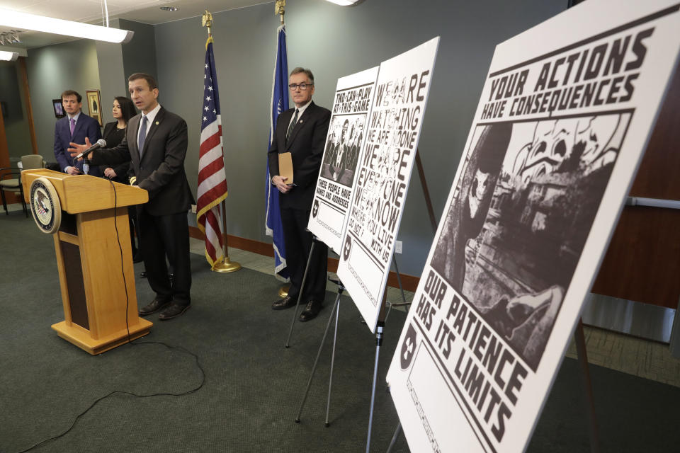 An FBI special agent discusses charges against four alleged members of the neo-Nazi group Atomwaffen Division for cyberstalking and mailing threatening communications to journalists. Some of the threatening posters that were sent to the journalists are displayed. (Photo: ASSOCIATED PRESS)