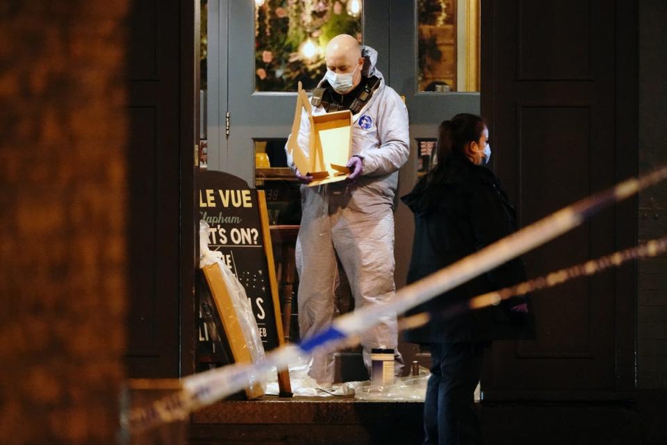 A forensic officer at the scene of a shooting in Clapham (Aaron Chown/PA Wire)