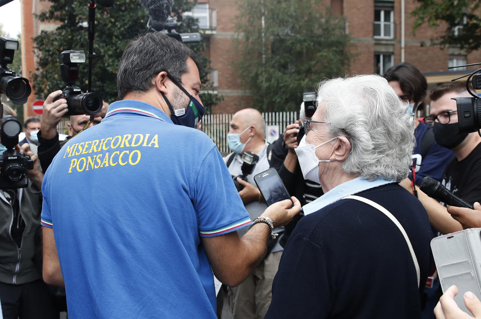 Right-wing opposition leader Matteo Salvini leaves a polling station, in Milan, Italy, Monday, Sept. 21, 2020. On Sunday and Monday Italians are called to vote nationwide in a referendum to confirm a historical change to the country's constitution to drastically reduce the number of Members of Parliament from 945 to 600. Eighteen million of Italian citizens will also vote on Sunday and Monday to renew local governors in seven regions, along with mayors in approximately 1,000 cities. (AP Photo/Antonio Calanni)