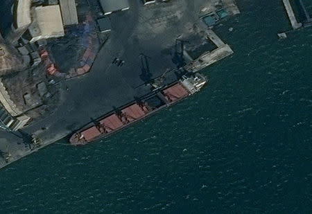 An undated surveillance image provided in a U.S. Department of Justice complaint for forfeiture released May 9, 2019 shows what is described as the North Korean vessel Wise Honest being loaded with coal in Nampo, North Korea. Department of Justice/Handout via REUTERS