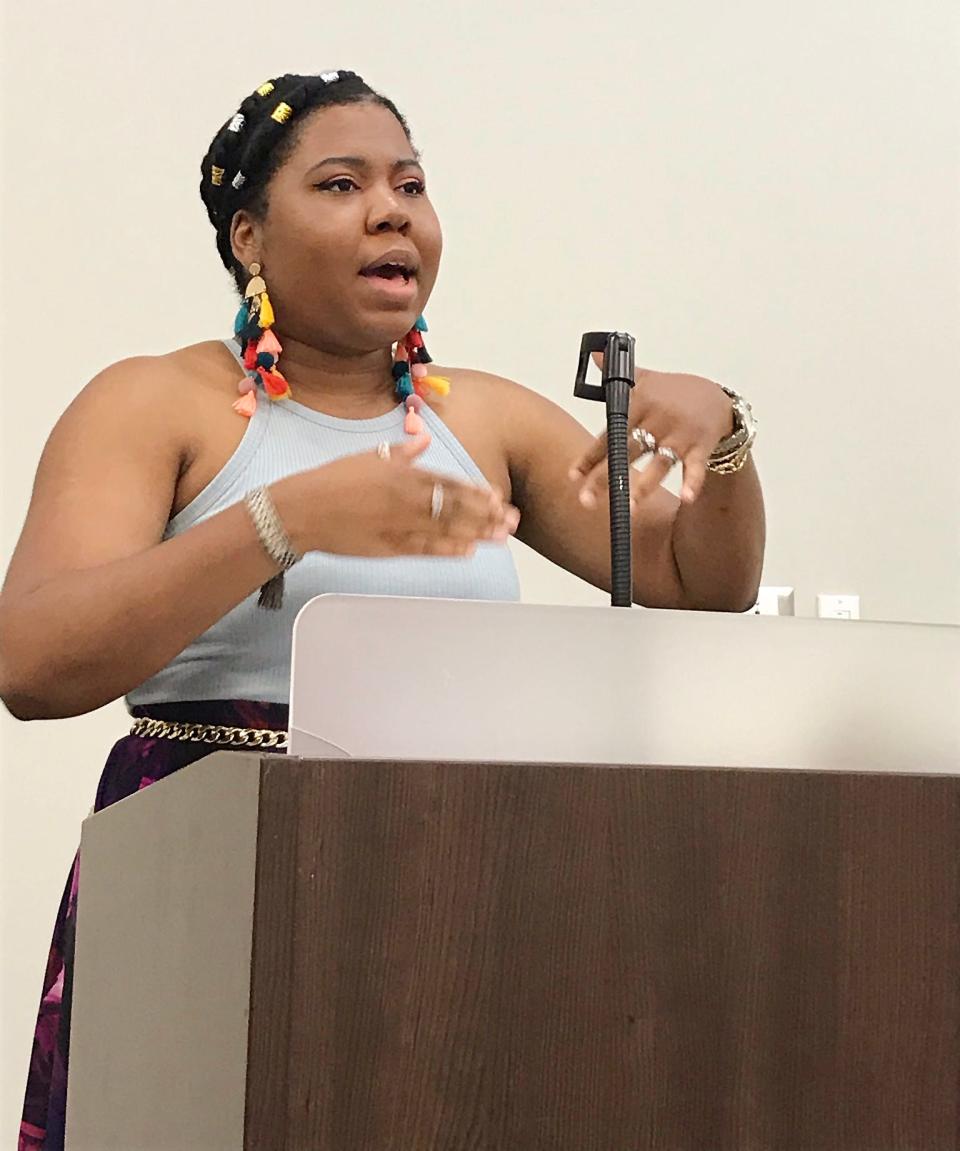 Ashley Jones, poet laureate of Alabama, reads from her works on Wednesday at a midday gathering at Gadsden State Community College.