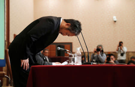 Jumpei Yasuda, the Japanese journalist held in Syria for more than three years, bows during a news conference for the first time since his release last month, at the Japan National Press Club in Tokyo, Japan November 2, 2018. REUTERS/Issei Kato