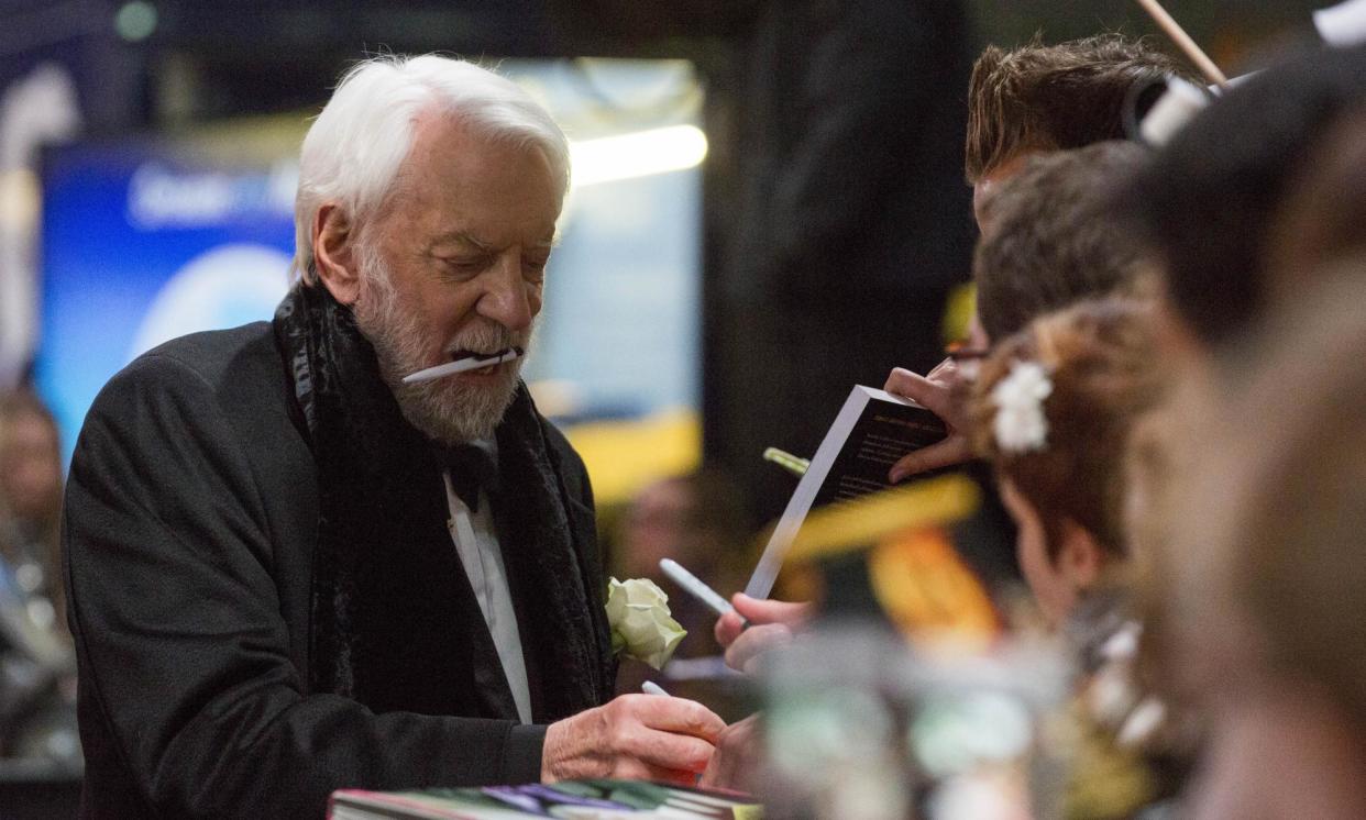 <span>Donald Sutherland signing autographs before the world premiere of The Hunger Games: Mockingjay – Part 2 in Berlin, Germany, November 2015.</span><span>Photograph: Gero Breloer/AP</span>