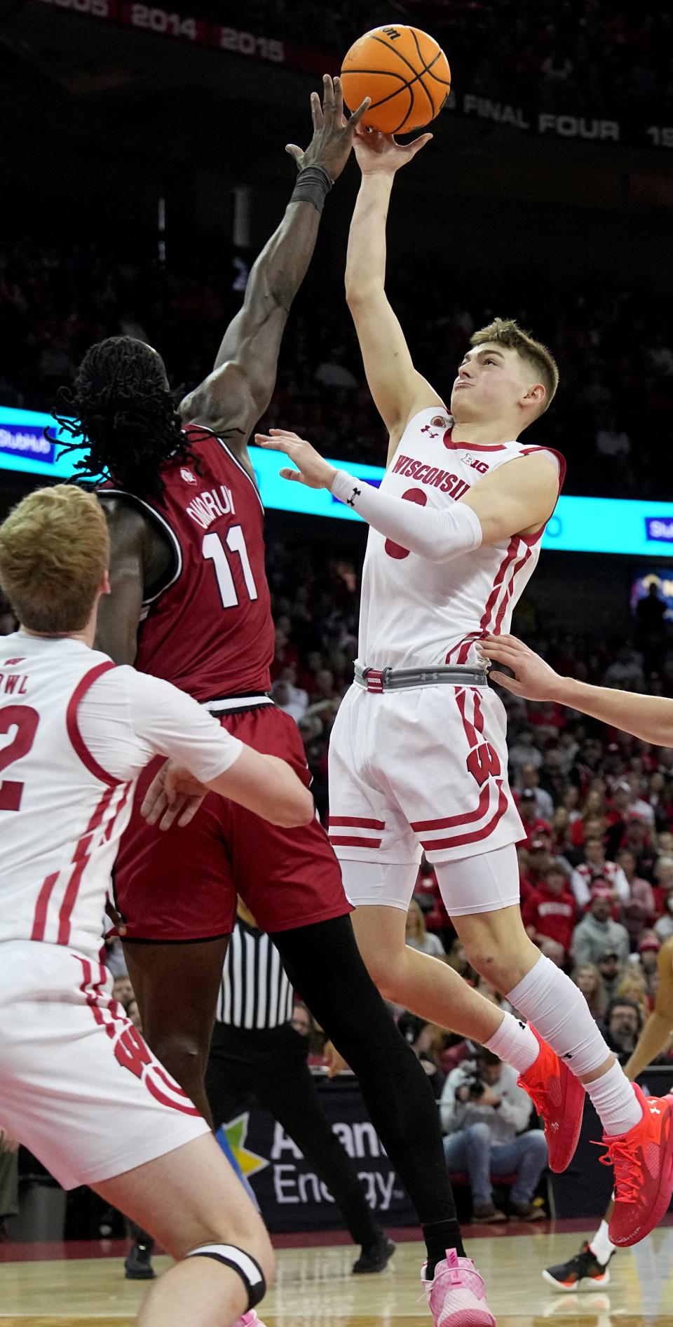 Wisconsin guard Connor Essegian misses a shot over over Rutgers center Clifford Omoruyi in the closing moments Saturday at the Kohl Center.