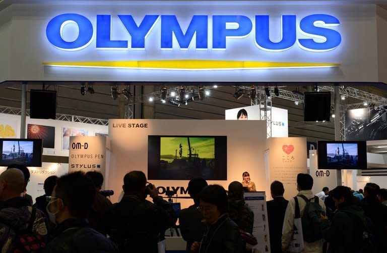 An Olympus booth at a photo-imaging show in Yokohama, on January 31, 2013. A Japanese court has handed suspended sentences to three former Olympus executives accused of engineering a massive accounting fraud at the camera and medical equipment maker