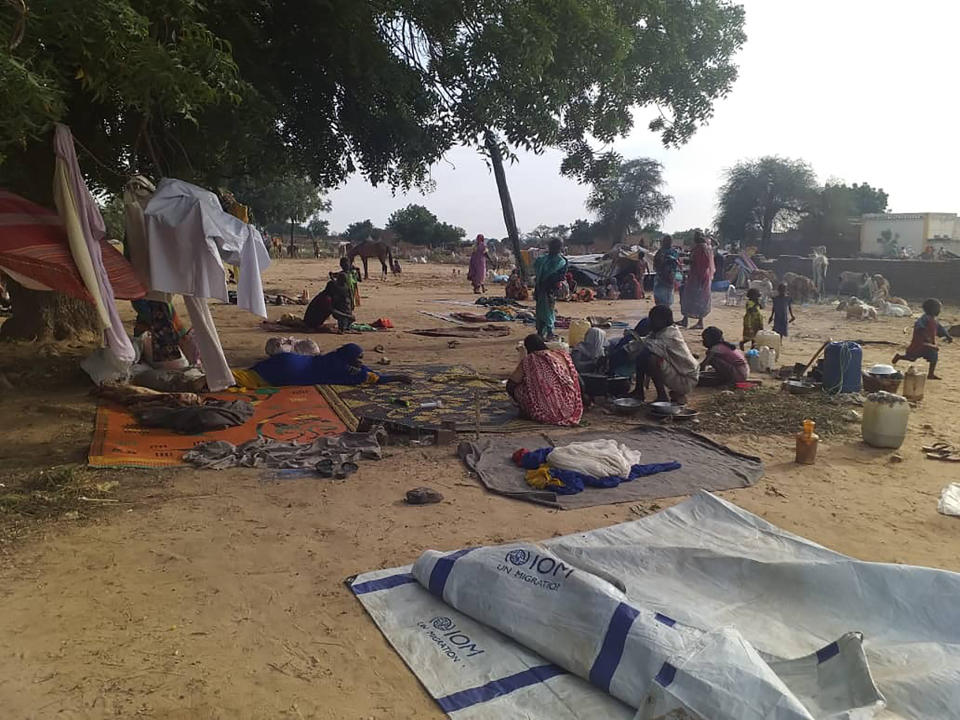 FILE - In this July 30, 2020 file photo, residents displaced from a surge of violent attacks squat on blankets and in hastily made tents in the village of Masteri in west Darfur, Sudan. The U.N. says ethnic fighting in Jan. 2021 in Darfur spanned two provinces, killing at least 250 people and displacing 120,000, mostly women and children. The Darfur bloodletting — just two weeks after the end of the joint U.N.-African Union peacekeeping force’s decade-long mandate in the region — raised questions about the government's ability to protect civilians there. (Mustafa Younes via AP, FIle)