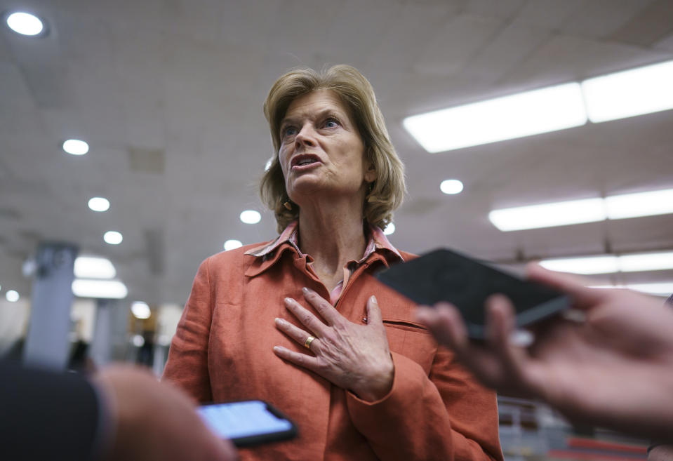 FILE - In this June 22, 2021 file photo, U.S. Sen. Lisa Murkowski, R-Alaska, a negotiator in the infrastructure talks, pauses for reporters on Capitol Hill in Washington. Murkowski hasn't officially announced her re-election plans but her campaign released fundraising details, Wednesday, July 14, 2021, that an advisor says "strongly positions," a re-election bid by Murkowski. The campaign statement comes ahead of a filing deadline and days after Republican party leaders in Alaska endorsed newcomer Kelly Tshibaka for Senate. (AP Photo/J. Scott Applewhite, File)