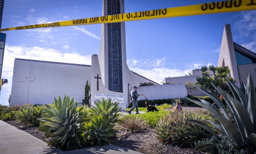 Laguna Woods, CA - May 15: An Orange County Sheriff's Officer with a bomb-sniffing dog checks the exterior of the church after a person opened fire during a church service attended by a Taiwanese congregation, killing one person and critically injuring four others at Geneva Presbyterian Church in Laguna Woods Sunday, May 15, 2022. Authorities are interviewing more than 30 people who were inside the church at the time. The victims were described as mostly Asian and mostly of Taiwanese descent, authorities said. A law enforcement source said officials believe the suspect was a 68-year-old Asian man who is originally from Las Vegas. The source said after the suspect opened fire he was "subdued" by parishioners. No other details were available. (Allen J. Schaben / Los Angeles Times)