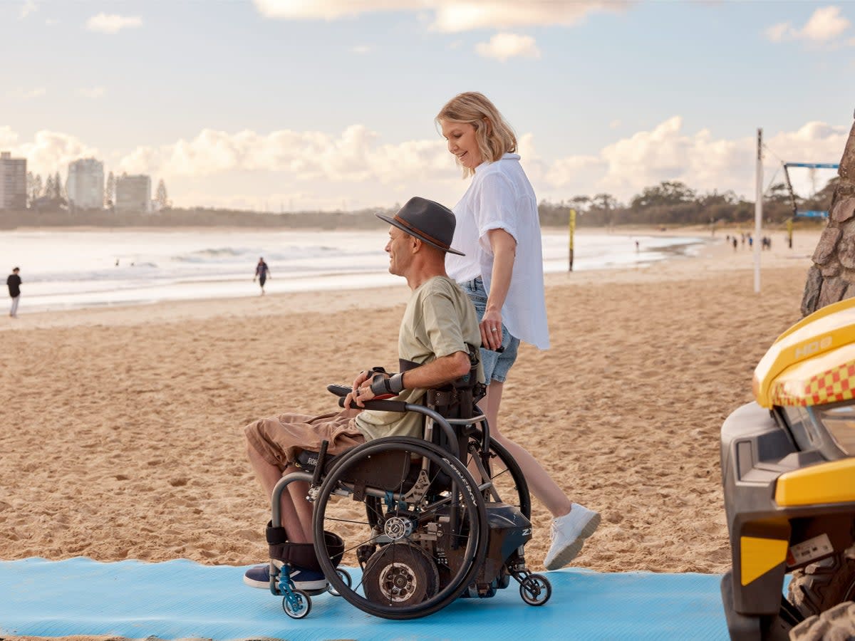 Accessible beach mats are opening up beaches like Mooloolaba to wheelchair users (Tourism and Events Queensland)