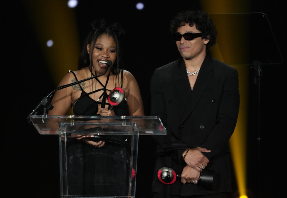 Dominique Fishback, left, and Anthony Ramos, accept the Rising Stars of the Year award at the Big Screen Achievement Awards during CinemaCon, the official convention of the National Association of Theatre Owners (NATO) at Caesars Palace on Thursday, April 27, 2023, in Las Vegas. (AP Photo/Chris Pizzello)