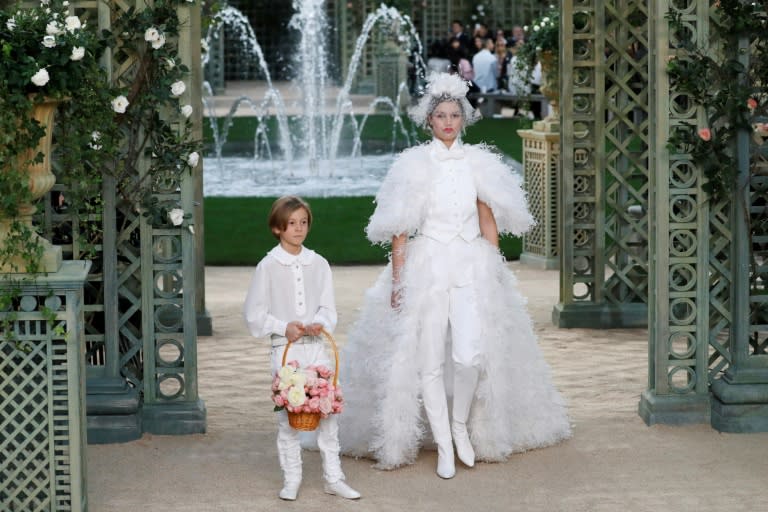 Amid all the frills and feathers, the bride -- the figure that traditionally closes Paris haute couture shows -- wore trousers