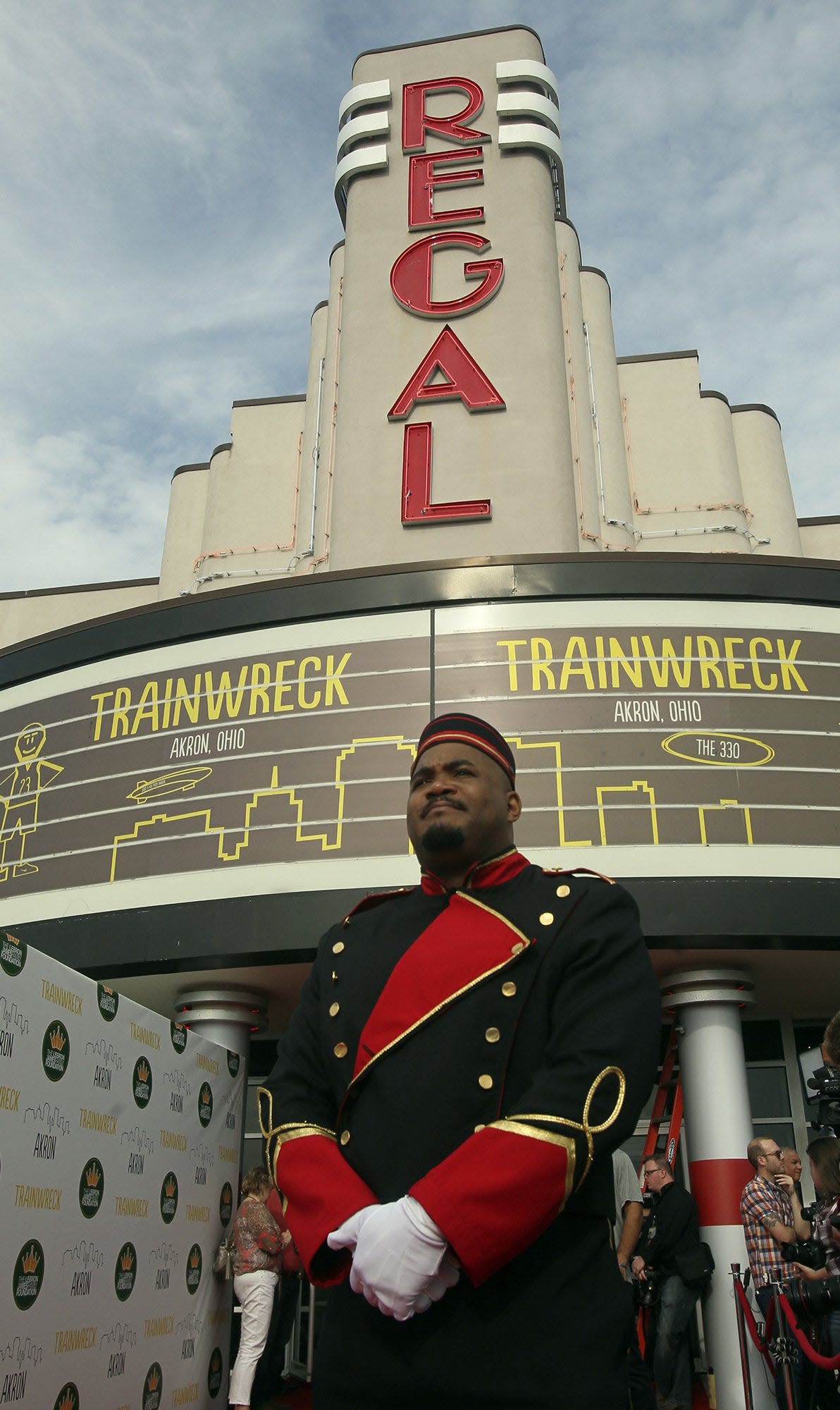 DeAngelo Graham waits  to greet special guests outside the Regal Cinema where the movie "Trainwreck" premiers Friday, July 10, 2015, in Copley Township, Ohio. The movie features Cleveland Cavaliers' star LeBron James in his first major screen role. (Michael Chritton/Akron Beacon Journal)