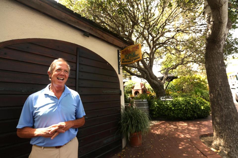 Real estate agent Tim Allen in front of the Forge in the Forest.