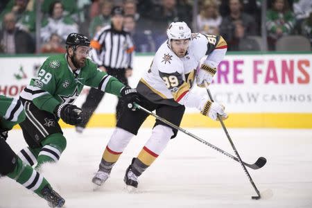 Dec 9, 2017; Dallas, TX, USA;Dallas Stars defenseman Greg Pateryn (29) and Vegas Golden Knights right wing Alex Tuch (89) fight for the puck during the third period at the American Airlines Center. The Golden Knights defeat the Stars 5-3. Mandatory Credit: Jerome Miron-USA TODAY Sports
