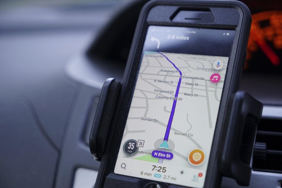 Former police data analyst Davin Hall uses the Waze navigation app while driving through Greensboro, N.C., on Wednesday, June 22, 2022. Hall quit the city's police force in part over its use of Fog Reveal, a powerful cellphone-tracking tool that the company says uses data from apps like Waze to track mobile devices. A Waze spokesperson said the company has not heard of Fog and has no relationship to it. (AP Photo/Allen G. Breed)