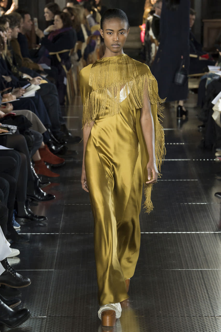 <p>Gabriela’s gold fringe dress in the most exquisite silk. (Photo: Getty Images) </p>