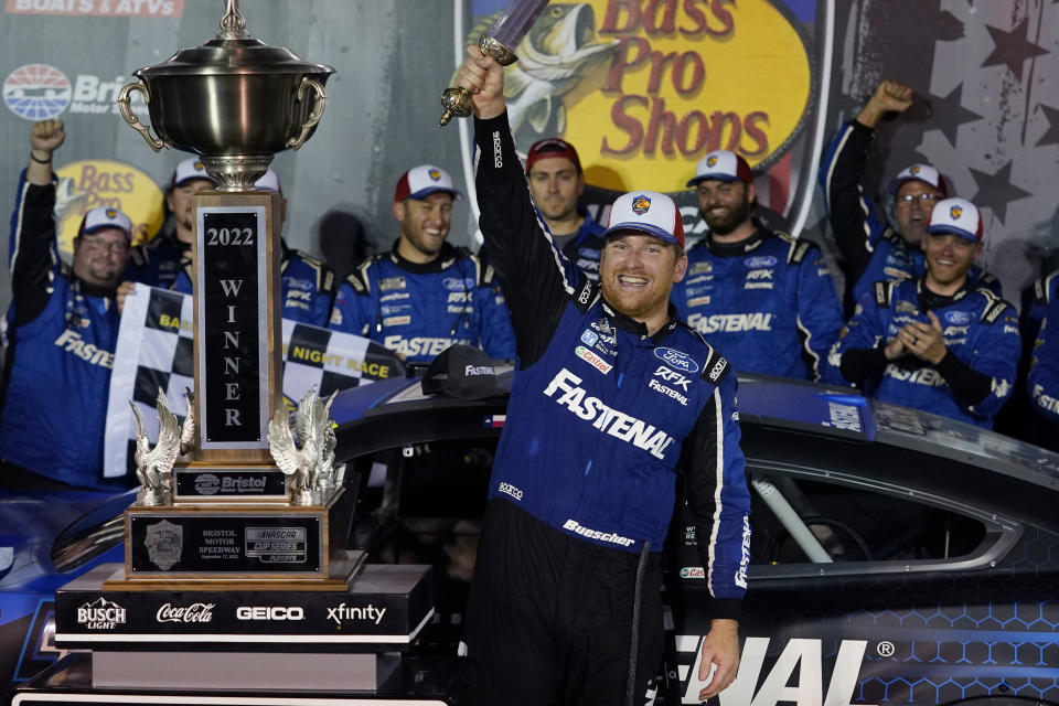 FILE - Chris Buescher celebrates with his trophy and sword after winning a NASCAR Cup Series auto race at Bristol Motor Speedway Saturday, Sept. 17, 2022, in Bristol, Tenn. (AP Photo/Mark Humphrey, File)